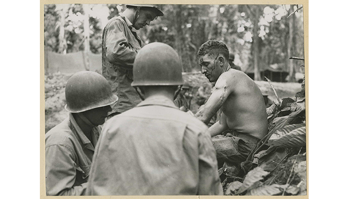 Combat medics treat a soldier of 37th Infantory Deivision