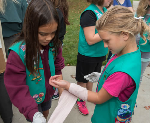 Girl Scouts practicing first-aid during Scout Day at NMHM.