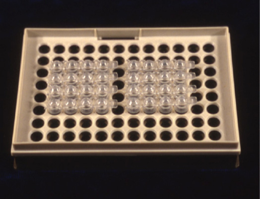 Plastic panel with 12x8 holes to serve as racking for Eppendorf tubes.
